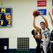 Green Hills senior Jackie Oestreich tries to control the ball and pass while defended by Arbor Prep on Monday, Feb. 11. Daniel Brenner I AnnArbor.com